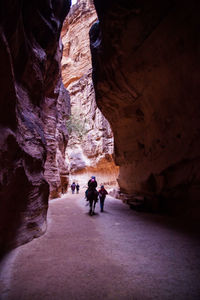 People walking in cave