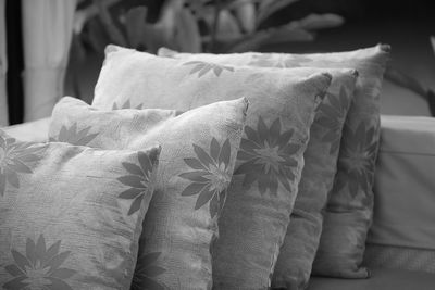 Close-up of cushions on bed at home