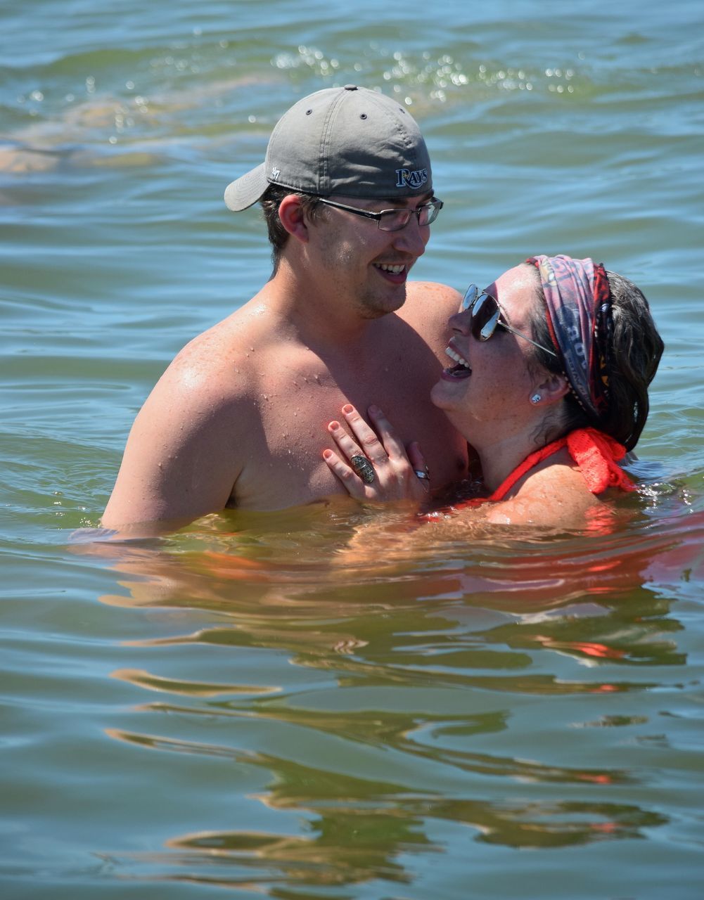 YOUNG WOMAN SWIMMING IN SEA