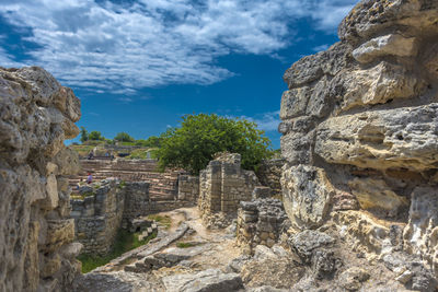 View of old ruins against cloudy sky
