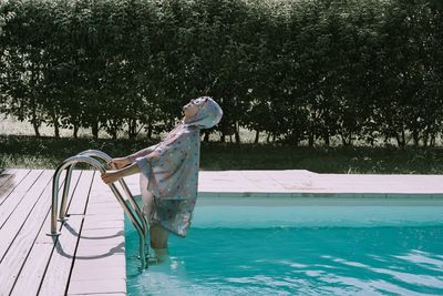 Man coming out from swimming pool