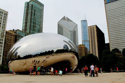 Tourists in front of modern building