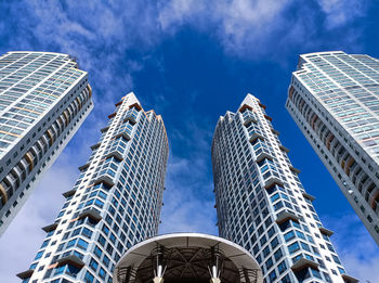 Low angle view of skyscraper against sky