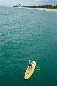High angle view of woman kayaking on sea