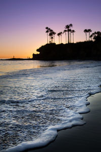 Scenic view of sea against clear sky during sunset