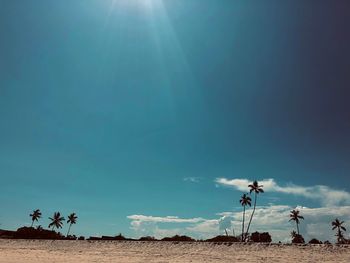 Low angle view of land against sky on sunny day