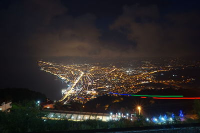 High angle view of illuminated city at night