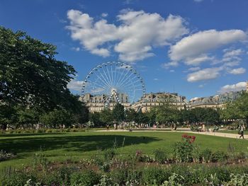 Ferris wheel in park against sky