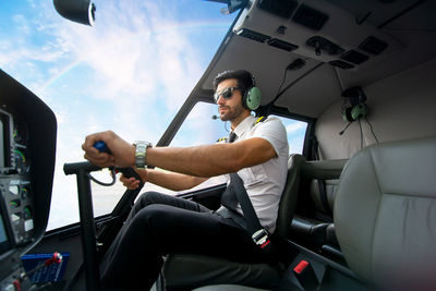 Man looking at camera while sitting in car