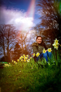 Portrait of woman holding plant