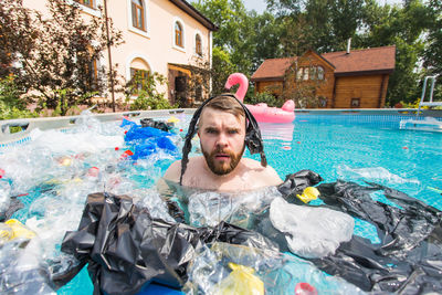 Portrait of young man in swimming pool