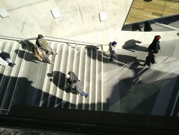 High angle view of people walking on road