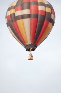 Low angle view of hot air balloon flying in sky