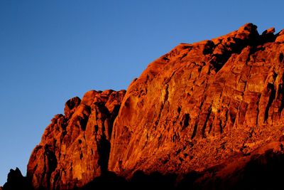 Low angle view of rock formation against clear sky