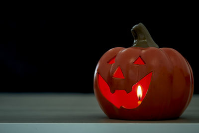 Close-up of pumpkin against black background