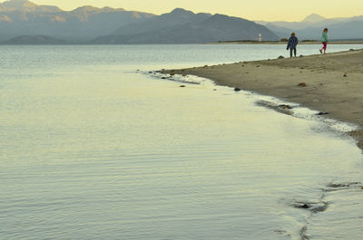 Scenic view of sea against mountains