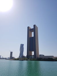 Modern buildings in city against clear sky