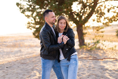 Young couple standing outdoors