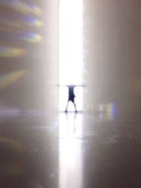 Reflection of man in water