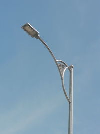 Low angle view of street light against sky