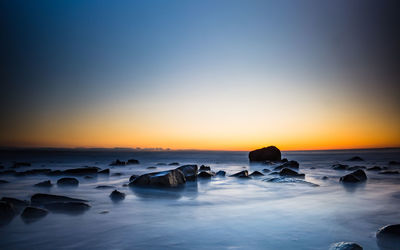 Scenic view of sea against sky during sunset