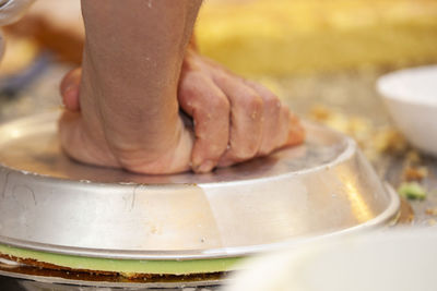 Close-up of person preparing food