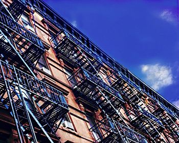 Low angle view of building against blue sky