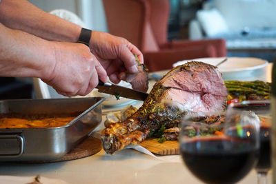 Cropped hand preparing food