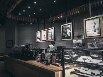 Low angle view of illuminated bottles on table