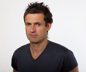 Portrait of young man against white background