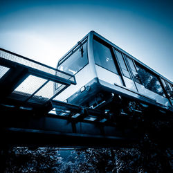 Low angle view of bridge against clear blue sky