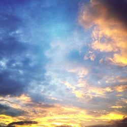 Low angle view of dramatic sky during sunset