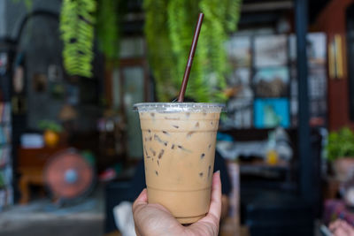 Close-up of hand holding drink