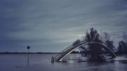 Bridge over river against sky