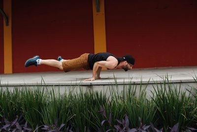 Full length of man relaxing on grass