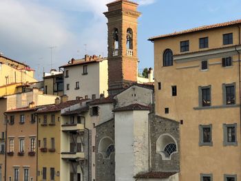 Low angle view of buildings against sky in city