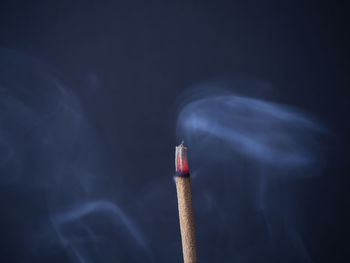 Close-up of cigarette against black background