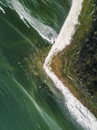 High angle view of waterfall by river