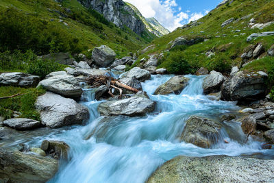 Creek mundbach in the valley gredetschtal in the swiss alps near mund, switzerland