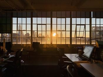 Sunrise view of new york city through industrial window front