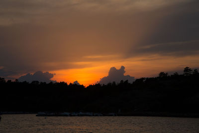 Scenic view of sea against orange sky