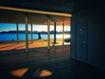 View of sea against sky seen through open door