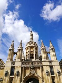 Low angle view of building against cloudy sky