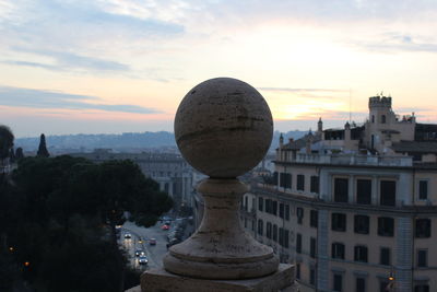 Hot air balloon in front of cathedral against sky