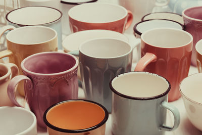 Close-up of coffee cups on table