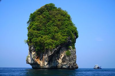 Scenic view of sea against clear blue sky