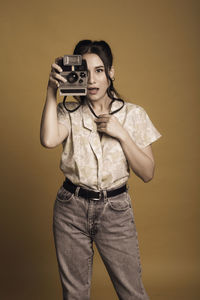 Portrait of woman photographing