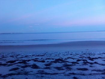 Scenic view of sea against blue sky