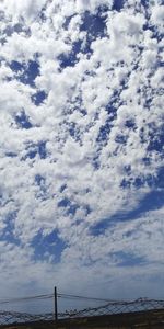 Low angle view of scenic view of beach against sky