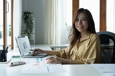 Portrait of businesswoman working at office